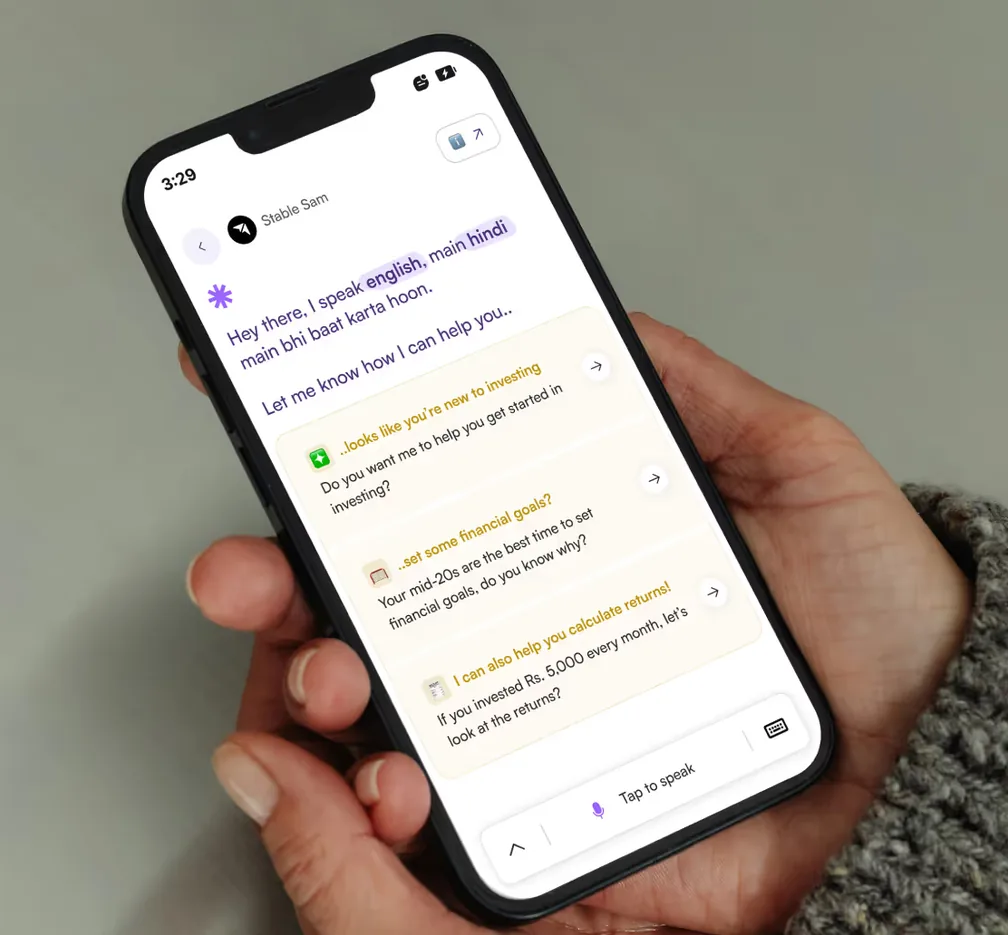 Stable Sam AI assistant held in hand