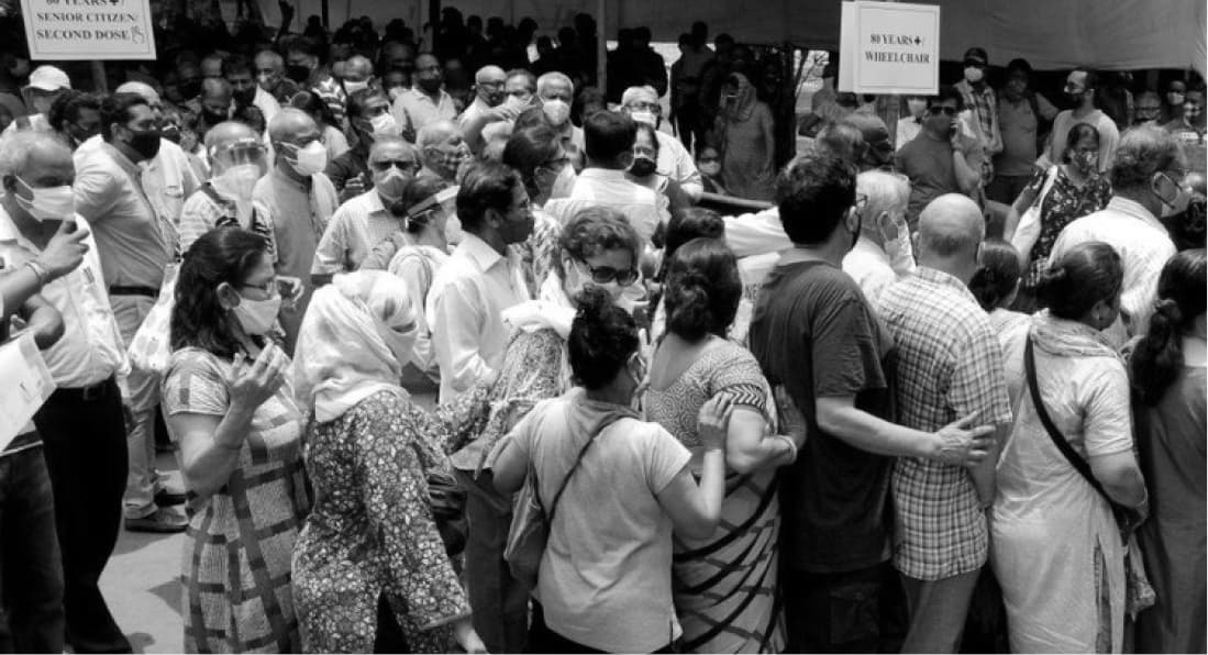 Crowd outside a hospital waiting for vaccines