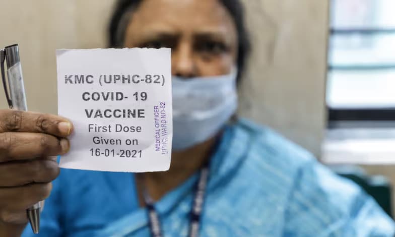 Woman showing her dose slip