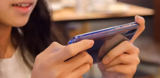 User playing a game on a phone
